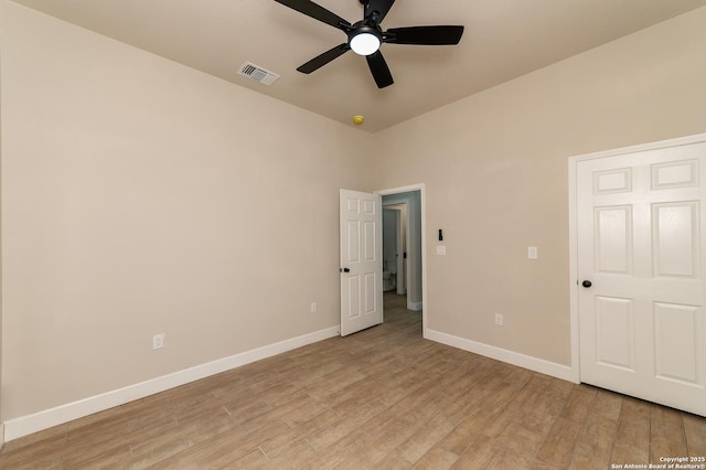 unfurnished bedroom with ceiling fan and light hardwood / wood-style floors