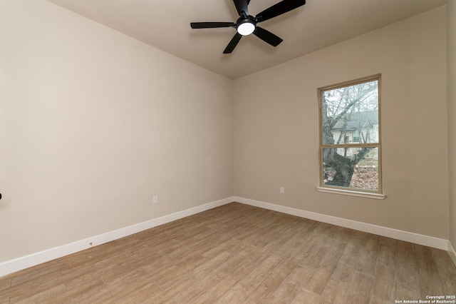 spare room with ceiling fan and light hardwood / wood-style flooring