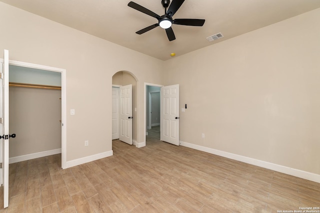 unfurnished bedroom with light hardwood / wood-style floors and ceiling fan