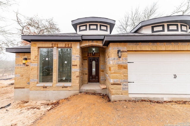 property entrance featuring a garage