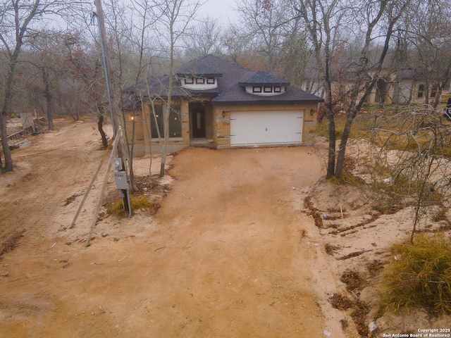 view of front of property featuring a garage