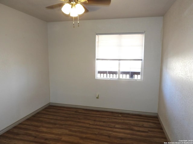 unfurnished room featuring ceiling fan and dark hardwood / wood-style flooring