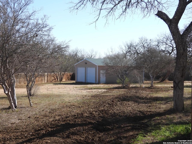 view of yard with a garage