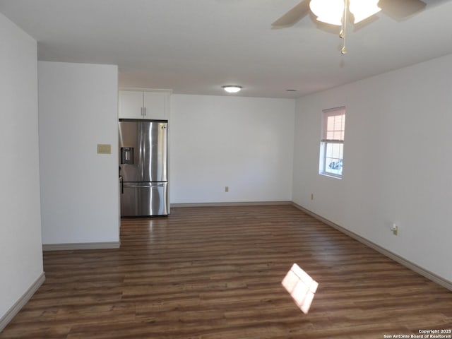 empty room featuring dark hardwood / wood-style floors and ceiling fan