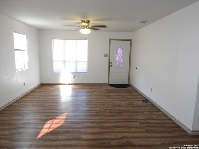 foyer featuring dark wood-type flooring and ceiling fan