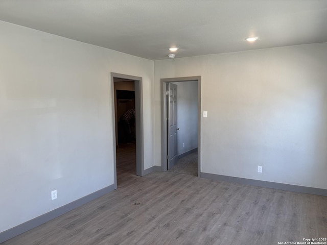 spare room featuring light hardwood / wood-style flooring