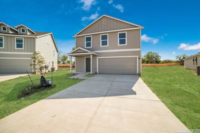 view of front of property with a garage and a front lawn