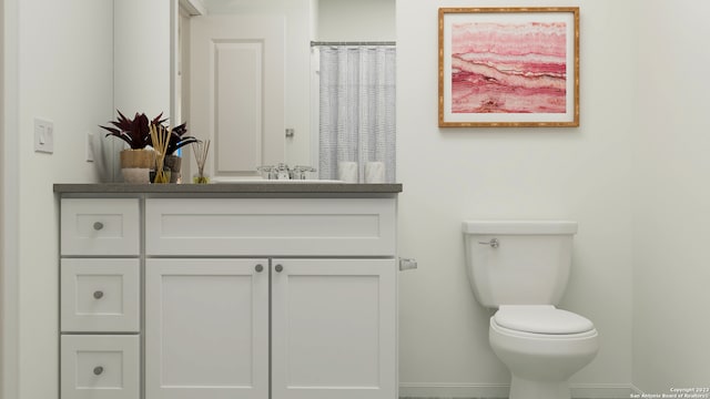 bathroom featuring vanity and toilet