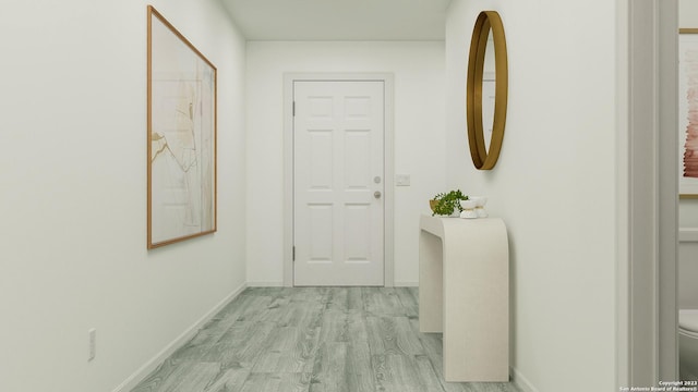 hallway with light hardwood / wood-style flooring