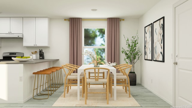 dining space featuring light wood-type flooring