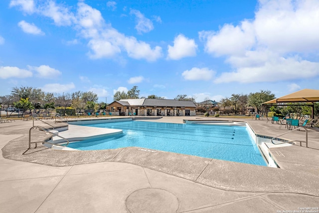 view of swimming pool featuring a patio area