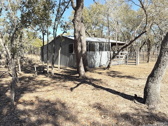 view of side of home with an outbuilding