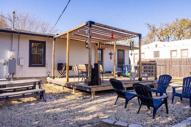 rear view of property featuring a wooden deck