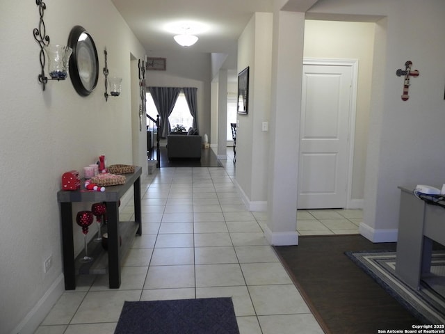 hallway with light tile patterned floors