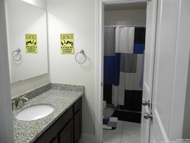 bathroom with vanity, tile patterned flooring, a shower with curtain, and toilet