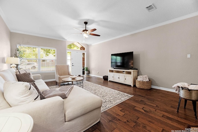 living room featuring dark hardwood / wood-style flooring, crown molding, and vaulted ceiling