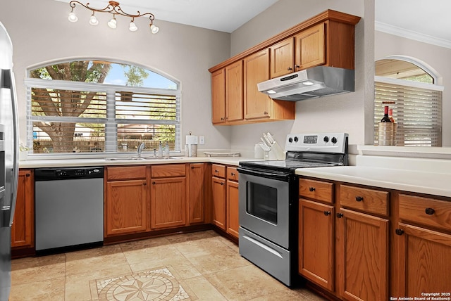 kitchen with sink, crown molding, and stainless steel appliances