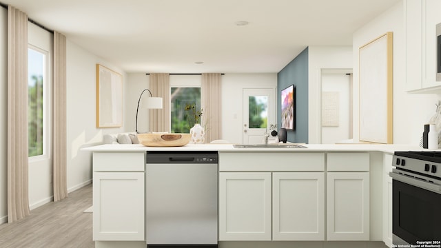 kitchen with sink, light hardwood / wood-style flooring, stainless steel appliances, and white cabinets