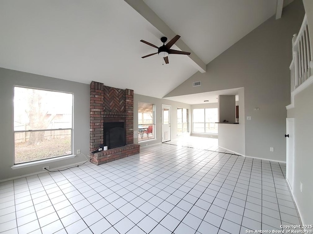 unfurnished living room featuring ceiling fan, high vaulted ceiling, light tile patterned flooring, a brick fireplace, and beamed ceiling