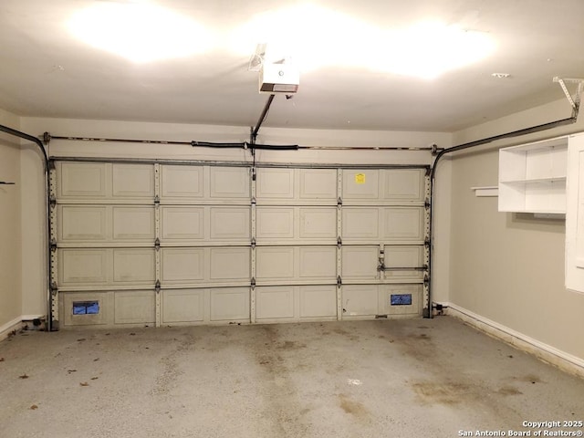 garage featuring a garage door opener