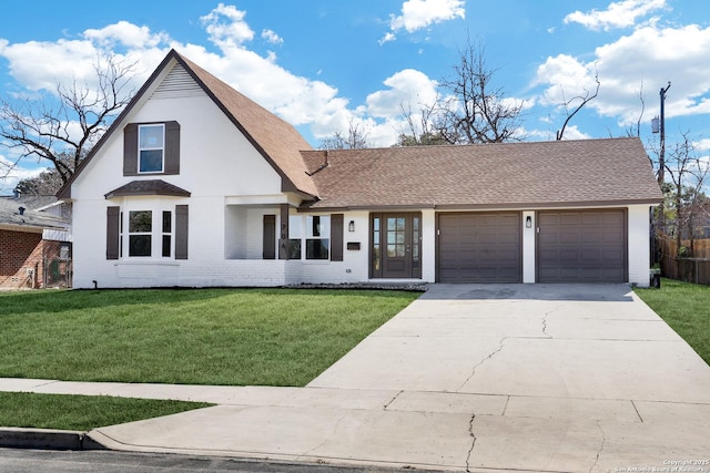 view of front of home featuring a garage and a front yard