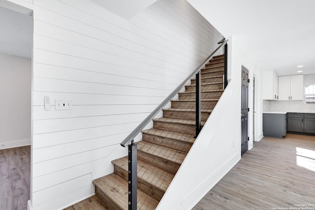 stairway featuring hardwood / wood-style flooring