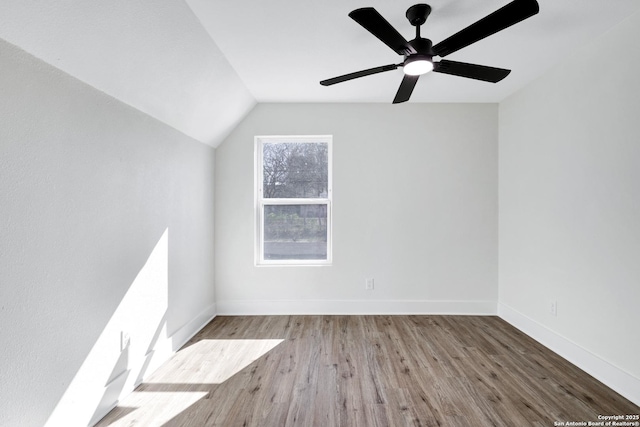 interior space featuring ceiling fan, lofted ceiling, and light hardwood / wood-style floors