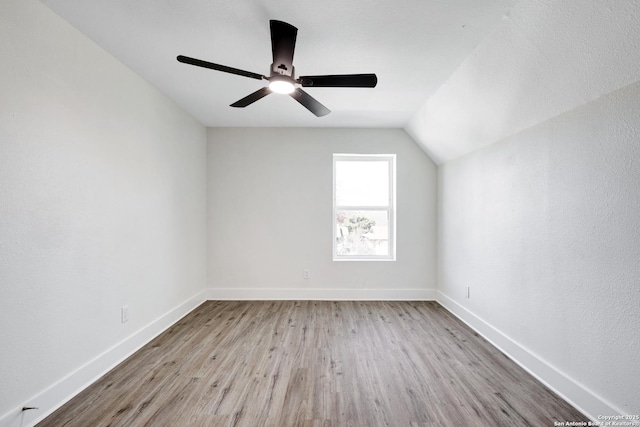 bonus room with vaulted ceiling, ceiling fan, and light hardwood / wood-style floors