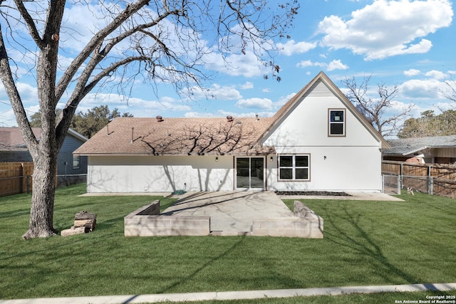 rear view of house featuring a yard and a patio area