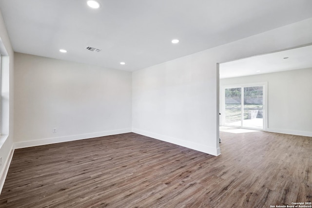 spare room featuring dark hardwood / wood-style floors