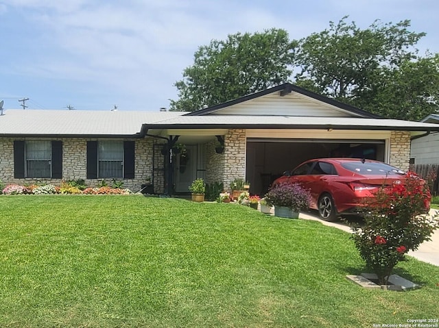 single story home with a garage and a front yard