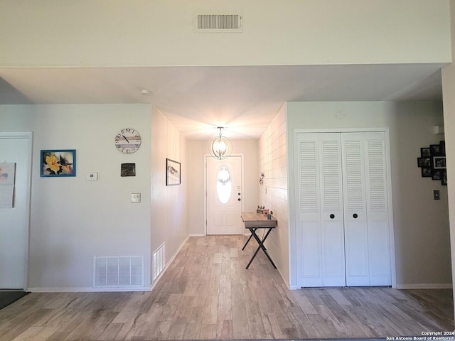 entryway with hardwood / wood-style flooring