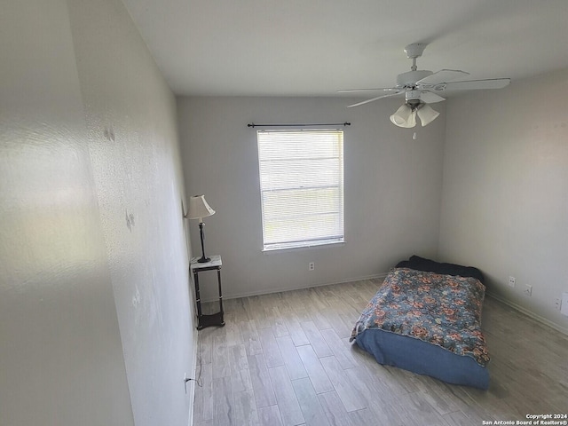 bedroom featuring light hardwood / wood-style flooring and ceiling fan