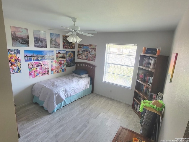 bedroom featuring ceiling fan and light hardwood / wood-style floors