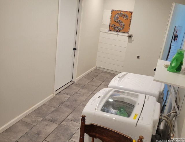 bathroom with tile patterned flooring and washing machine and dryer