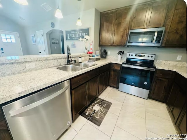 kitchen featuring sink, dark brown cabinets, kitchen peninsula, pendant lighting, and stainless steel appliances