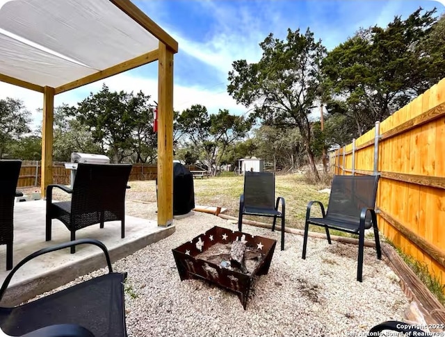 view of patio / terrace featuring a grill and a fire pit