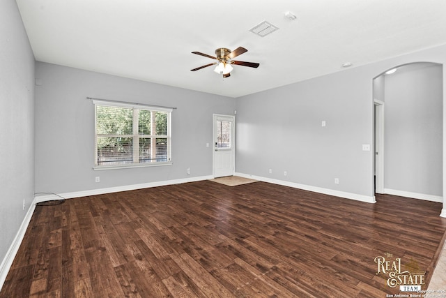 unfurnished room with dark wood-type flooring and ceiling fan