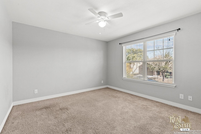 spare room with carpet flooring and ceiling fan