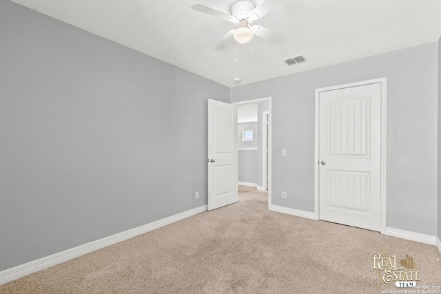 unfurnished bedroom with ceiling fan and carpet flooring