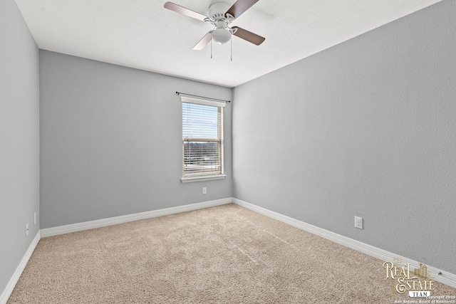 empty room with a textured ceiling, ceiling fan, and carpet flooring