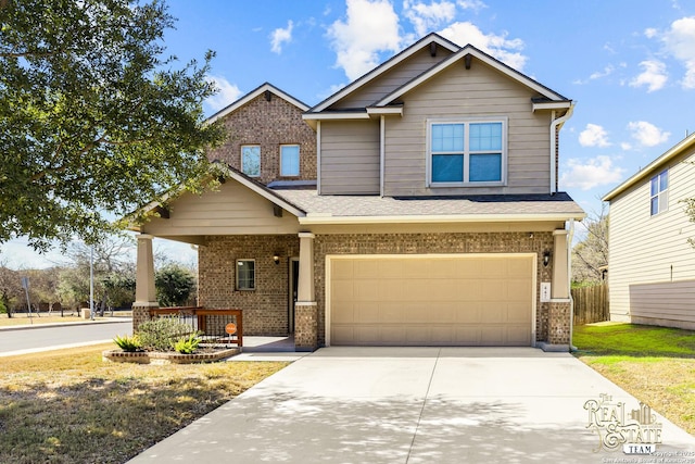 craftsman-style home featuring a garage and covered porch