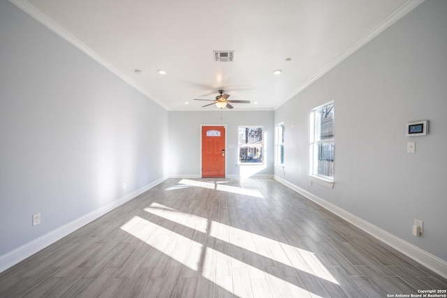 interior space featuring crown molding, ceiling fan, and light wood-type flooring