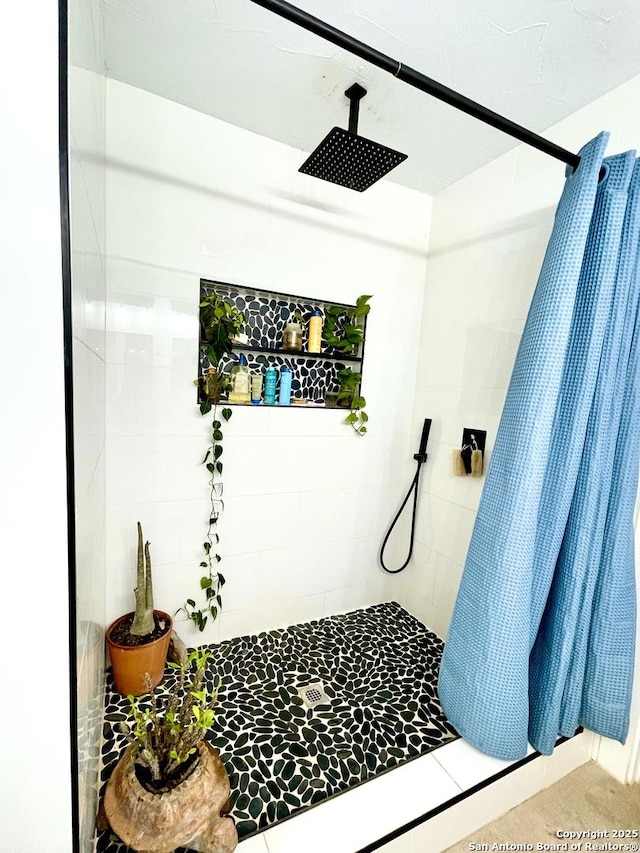 bathroom featuring a shower with curtain