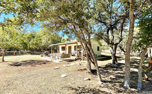 exterior space with an outdoor living space and a patio area