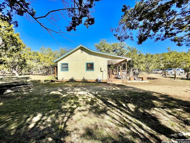 view of property exterior featuring a lawn