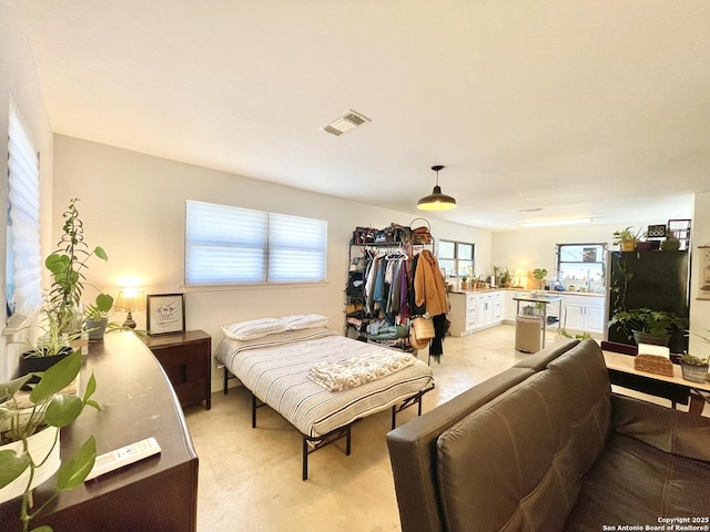 carpeted bedroom featuring sink