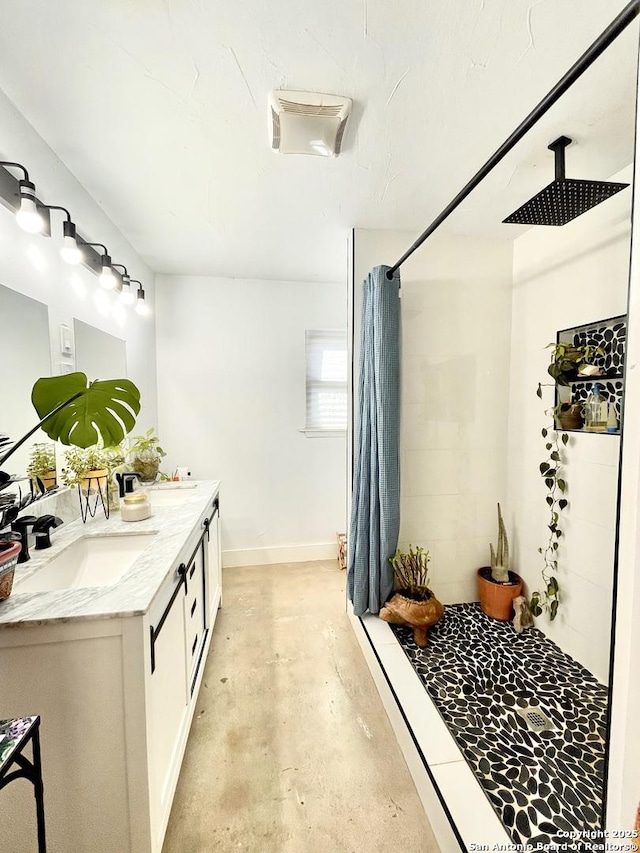 bathroom with vanity, concrete floors, and a shower with curtain