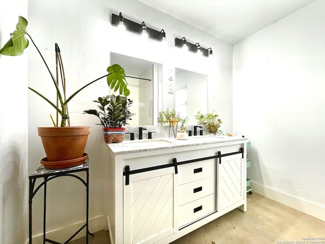 bathroom with vanity and concrete floors