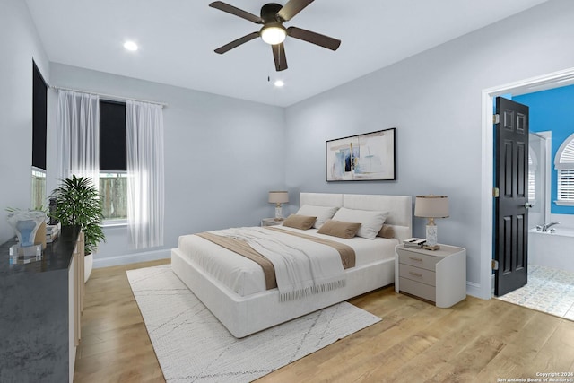 bedroom featuring ceiling fan and light hardwood / wood-style flooring